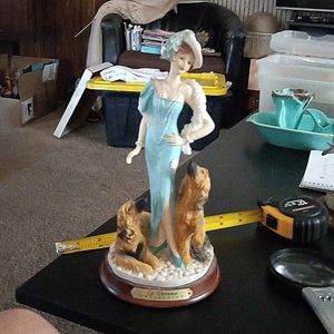 La Verona statue of beautiful woman in a blue dress with her two georgous dogs.